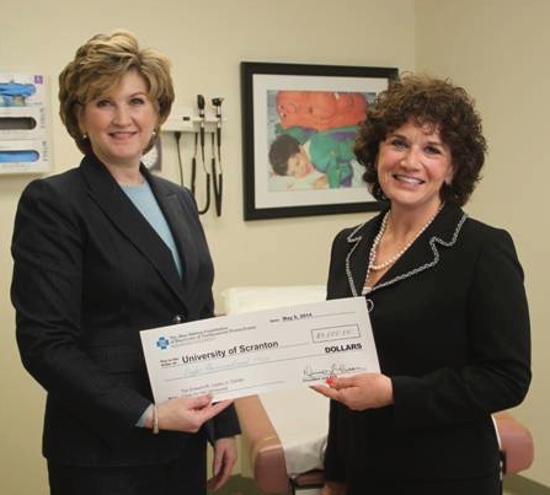 The Blue Ribbon Foundation of Blue Cross of Northeastern Pennsylvania presented an $8,000 grant to The University of Scranton Edward R. Leahy Center Clinic for the Uninsured. From left are Cynthia Yevich, executive director, The Blue Ribbon Foundation of Blue Cross of Northeastern Pennsylvania, and Andrea Matione, director, The University of Scranton Edward R. Leahy Center Clinic for the Uninsured.